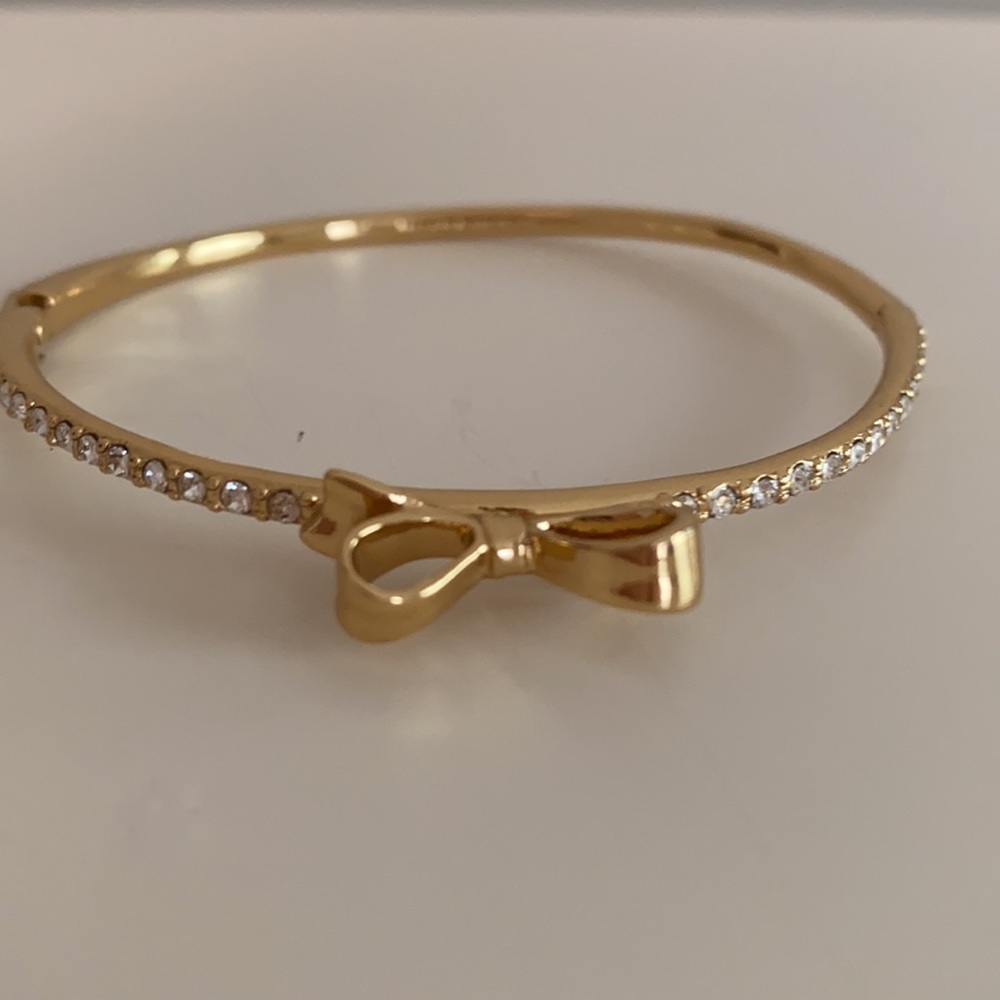 Kate Spade gold bow & clear stone bracelet